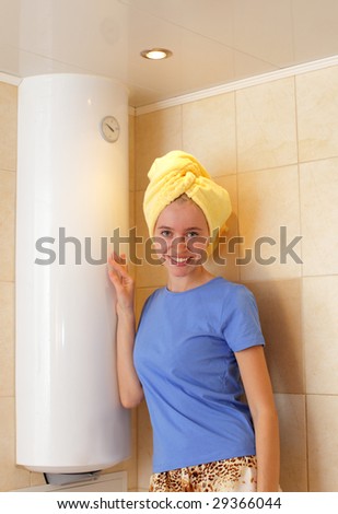 Happiness girl about a water heater