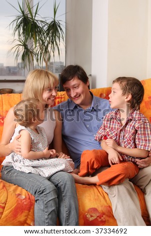 Happy family of the house on a sofa 6