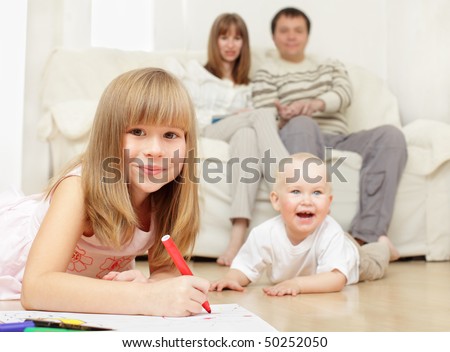 Happy family with two children at home