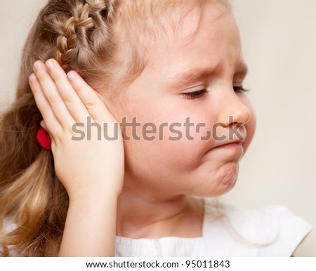 Child Has A Sore Ear. Little Girl Suffering From