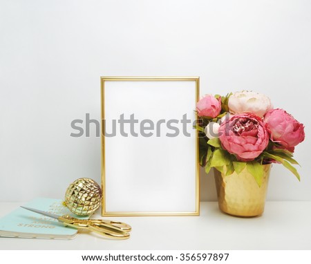 Gold frame mock-up, and white wall with gold vase, and peonies\
Place work