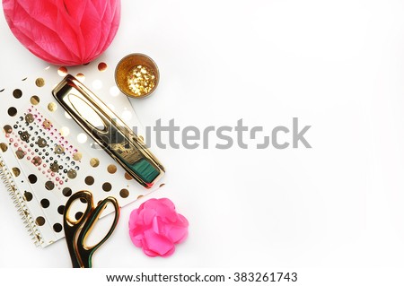 Flat lay, gold stationery on white table, notebook and stapler, woman style, desktop modern