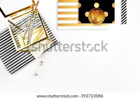 Woman desktop elegant. Flat lay. Gold items on the table. White mock-up background.\
Header or hero website. mock up for artwork .View from above