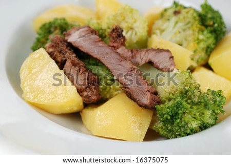 Tender fillet beef steak salad with mustard sauced broccoli, and boiled potato