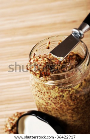 French old style seeded mustard on knife