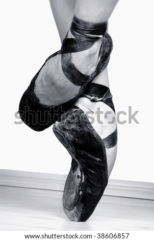 stock photo : A pair of well worn black ballet shoes, studio shot Black and