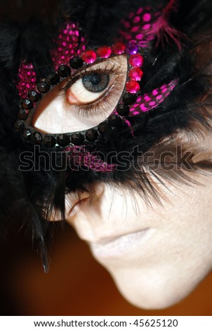 stock photo : Woman wearing carnival mask, colored eye lenses and white 