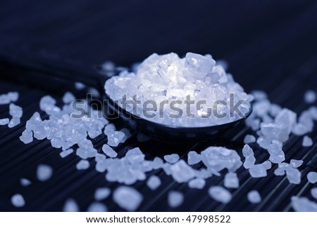 Sea Salt on spoon, studio shot blue filtered with spot light