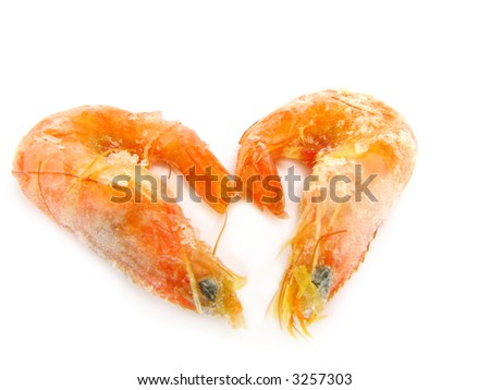 Two frozen shrimps on a white background.