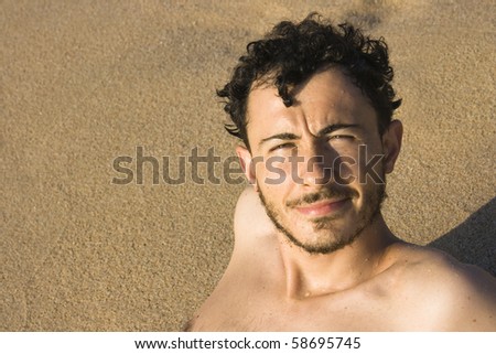 Handsome italian man at the beach of Monte Ruiu, Sardinia, Italy