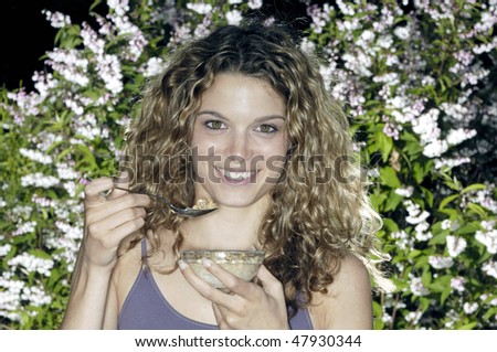 Smiling eating cereals