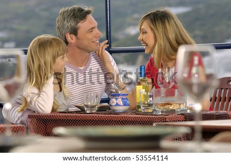 family enjoying in a restaurant