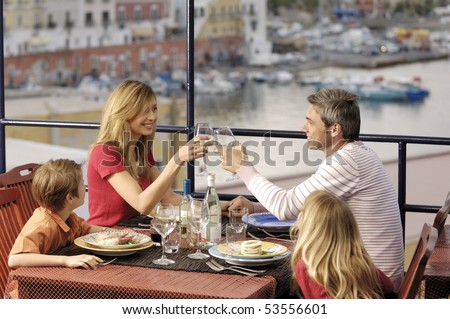 family in a sea restaurant