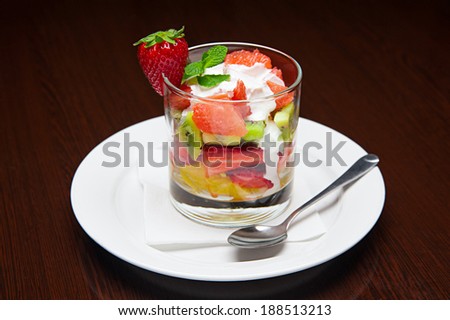 The menu - photo - appetizing dessert from fruits with whipped cream