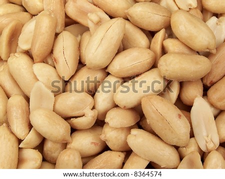 Full frame close-up photograph of salted party peanuts.