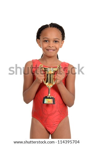 South African child with gymnastics trophy