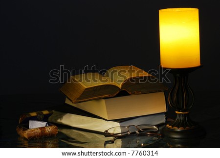 Old Lamp and Books with reading glasses
