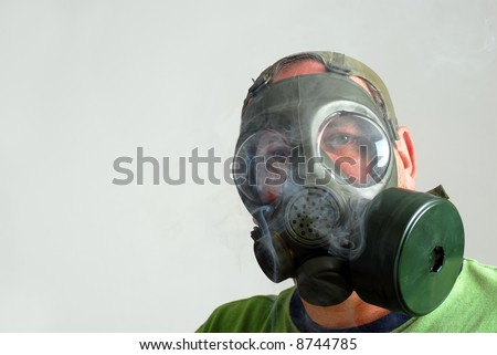 Man wearing a gas mask to avoid second hand smoke