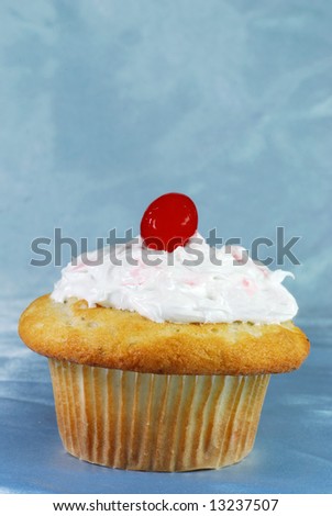 Blueberry Cupcake with a maraschino cherry