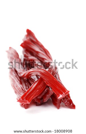 Red Licorice on white with a shallow DOF
