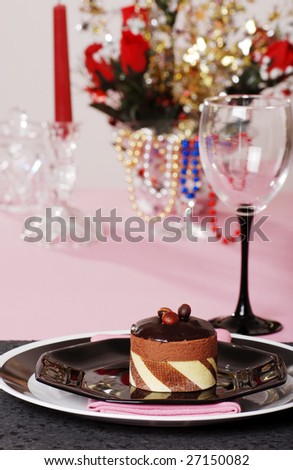 chocolate truffle cake with pink and black table setting