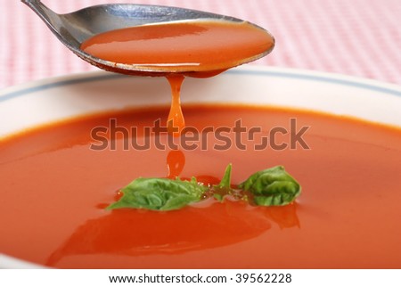 tomato soup dripping off a spoon