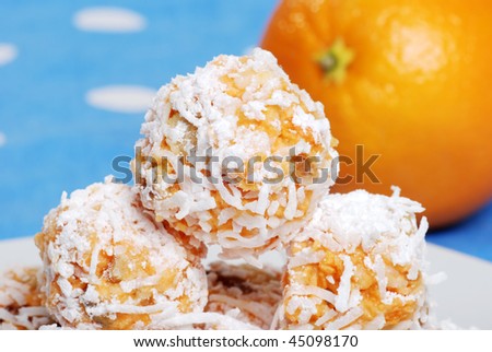 macro of orange snowball cookies