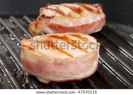 Two Bacon Wrapped Chicken On The Grill