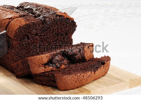 cutting slice belgium chocolate cake focus on knife tip