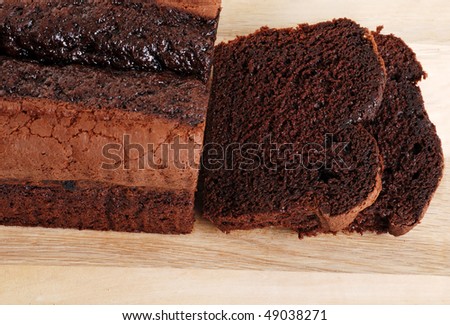 top view belgium chocolate cake loaf focus on slice