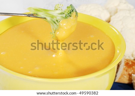 closeup of cheese fondue with broccoli