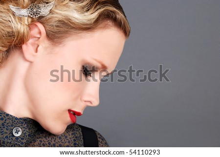 blond woman with red lipstick side profile