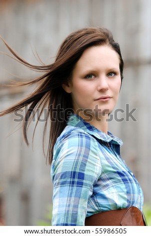 country woman with her hair blowing in the wind