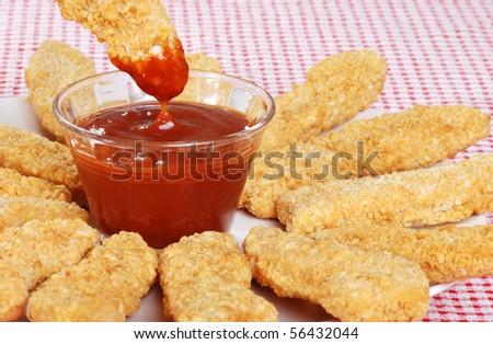 closeup BBQ sauce with chicken fingers