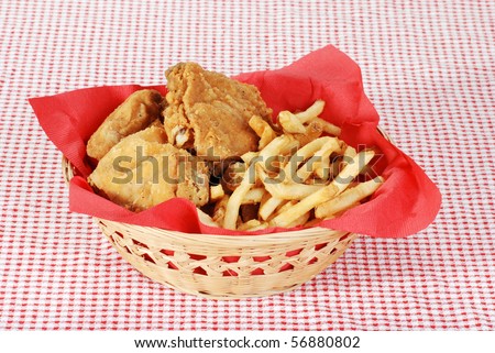 stock-photo-fried-chicken-and-french-fries-in-basket-56880802.jpg