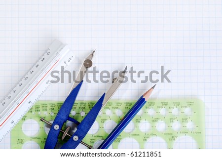 drafting tools on graph paper
