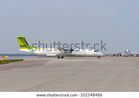 RUSSIA, DOMODEDOVO - 01 SEPTEMBER 2011: Aircraft De Havilland DHC-8 Dash 8 operated by Air Baltic is taxiing on September 01, 2011. Latvian flag carrier airline and a low-cost carrier.
