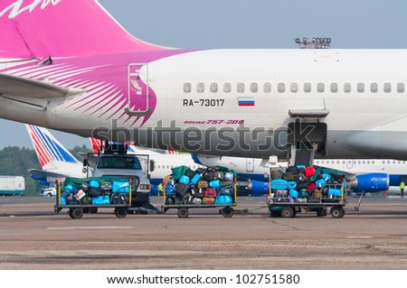 RUSSIA, DOMODEDOVO - 01 SEPTEMBER 2011: Luggage carts before loading baggage in aircraft operated by Vim Aviation on September 01, 2011. The airline's fleet consists of 11 Boeing 757-200.