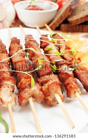 Shish kebab on bamboo sticks, flavored with herbs