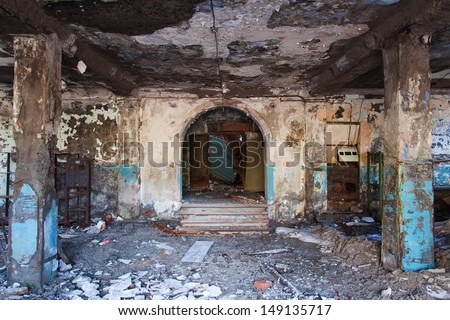 Arched entrance to an abandoned building