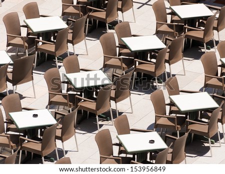 Rows of empty tables in the cafe.