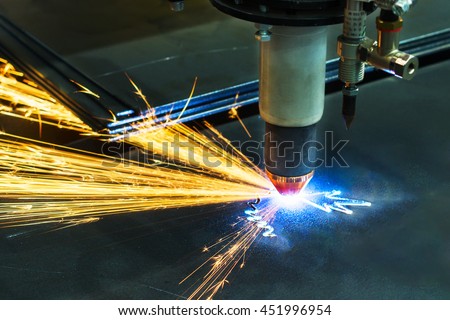CNC plasma cutting machine during operation. Processing of the steel sheet.