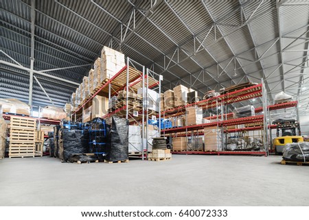 Large hangar warehouse industrial and logistics companies. Warehousing on the floor and called the high shelves.