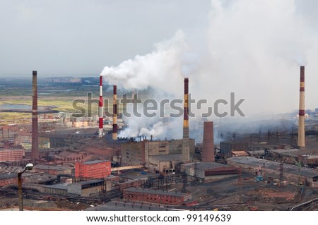 Metallurgical plant polluting the atmosphere with sulfur dioxide. Metallurgical plant of nickel, one of the oldest, built in the thirties of last century.