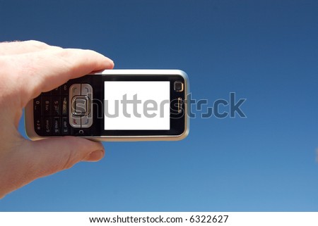 A mobile phone on a blue sky background. Copy-space on the phone screen.