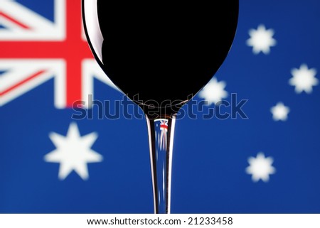 A glass of red wine, with an Australian flag background.