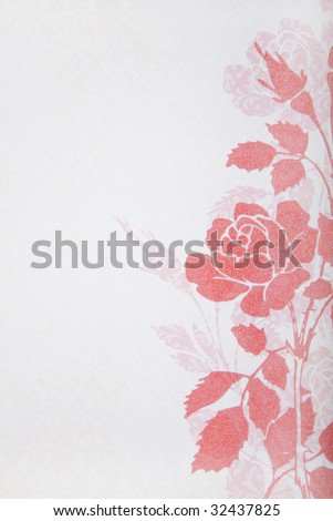 An old decorative paper background. Pink floral design on pale pink background. Floral design has gold glitter embedded.