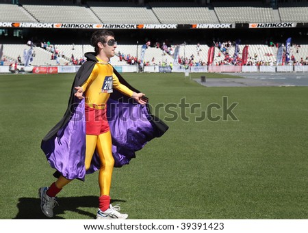 MELBOURNE - OCTOBER 11: A competitor dressed as an urban super hero in the final stages of the 2009 Melbourne marathon. October 11, 2009 in Melbourne.