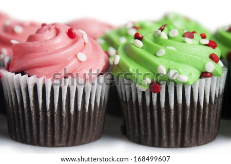 Shot of mini cupcakes isolated over white.