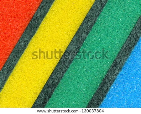 Colorful sponges for washing dishes. Abstract background.